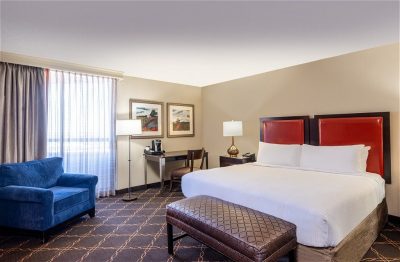 Austin hotel room with bed and chair